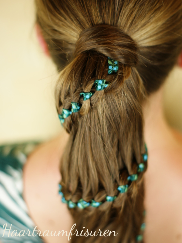 Green ribbon in four strand braid
